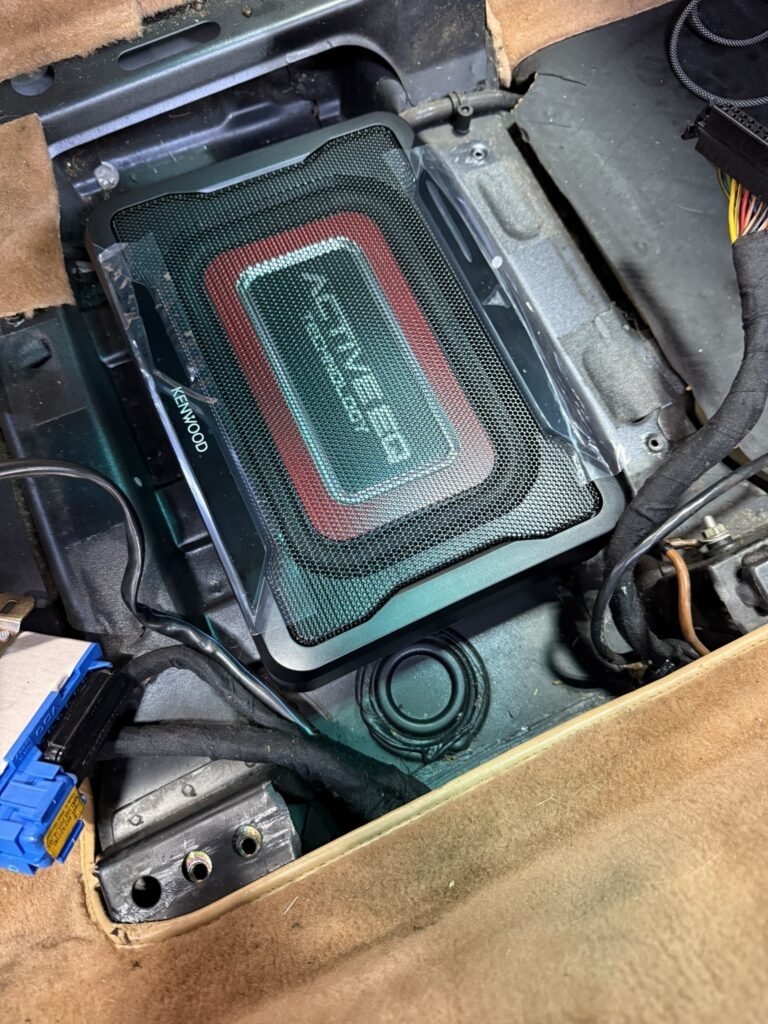 Test fitting the Kenwood KSC-PSW7EQ powered subwoofer under the seat in a Porsche 993
